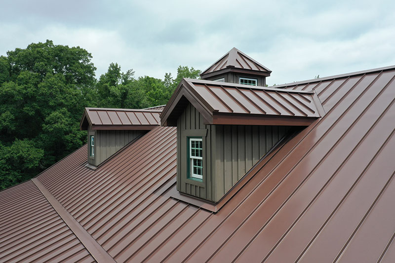 Brown metal roof with 2 dormers